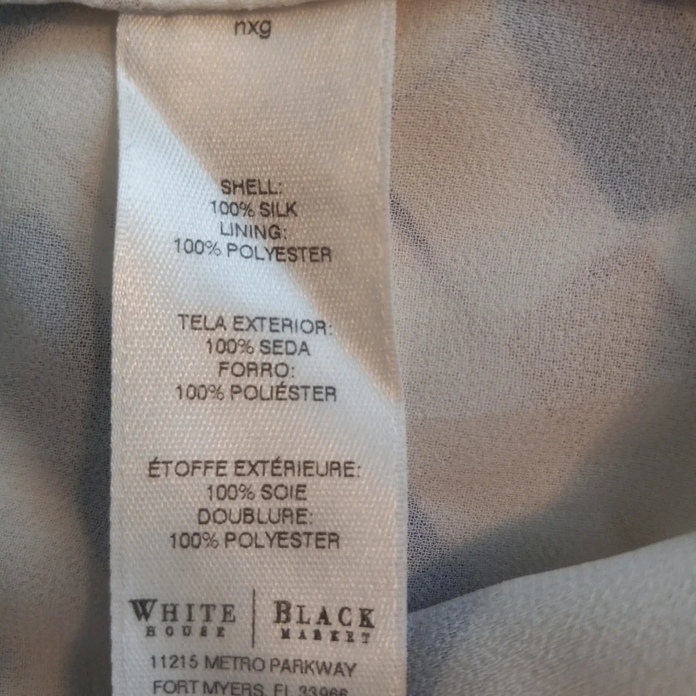 White House Black Market silk assymetrical sleeveless top with geometric…